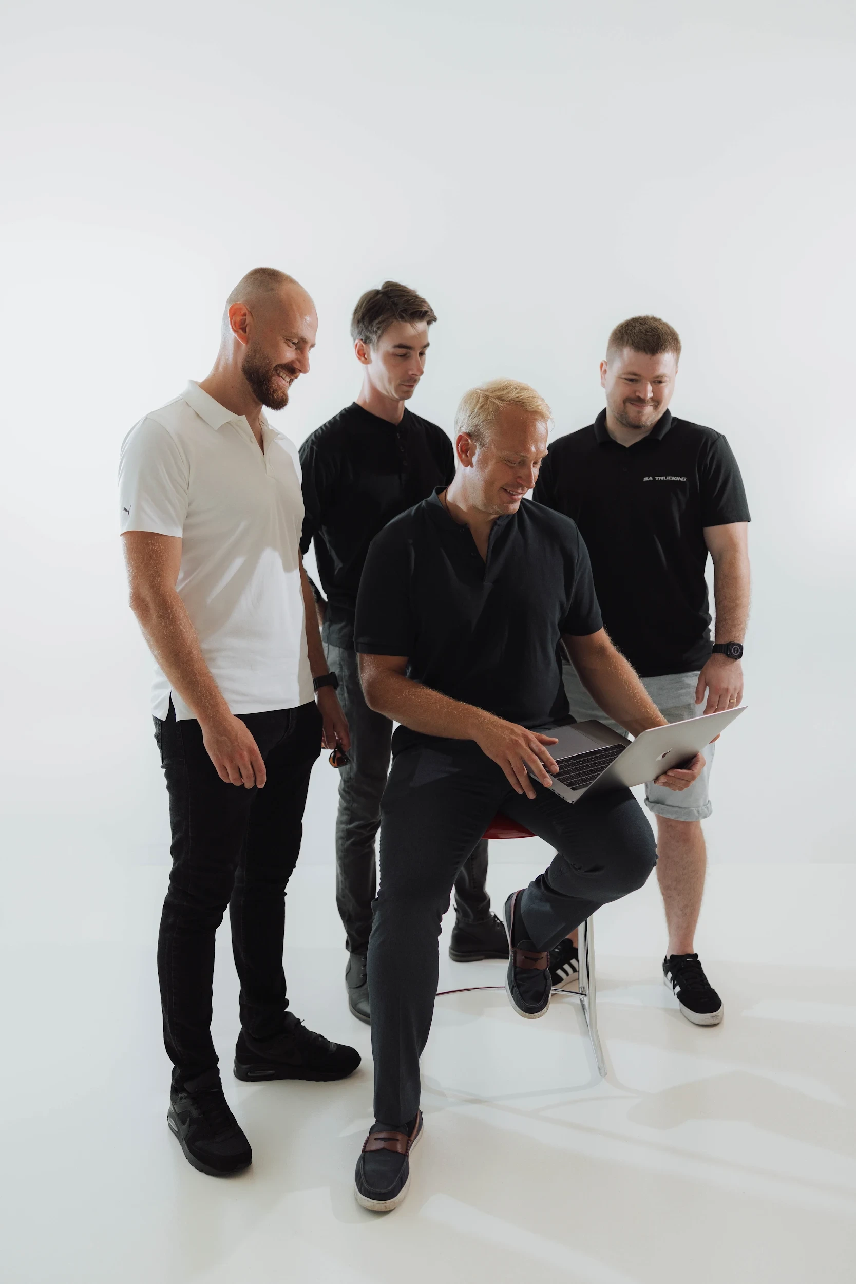 SA Trucking team reviewing a laptop